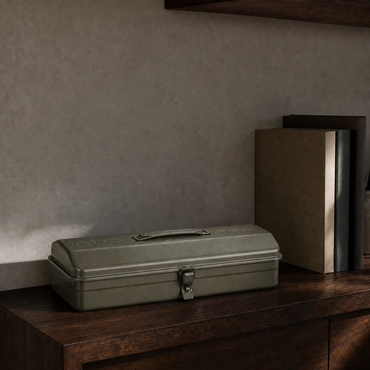 Military Green Toyo Steel Y-350 on a dark wood studio shelf