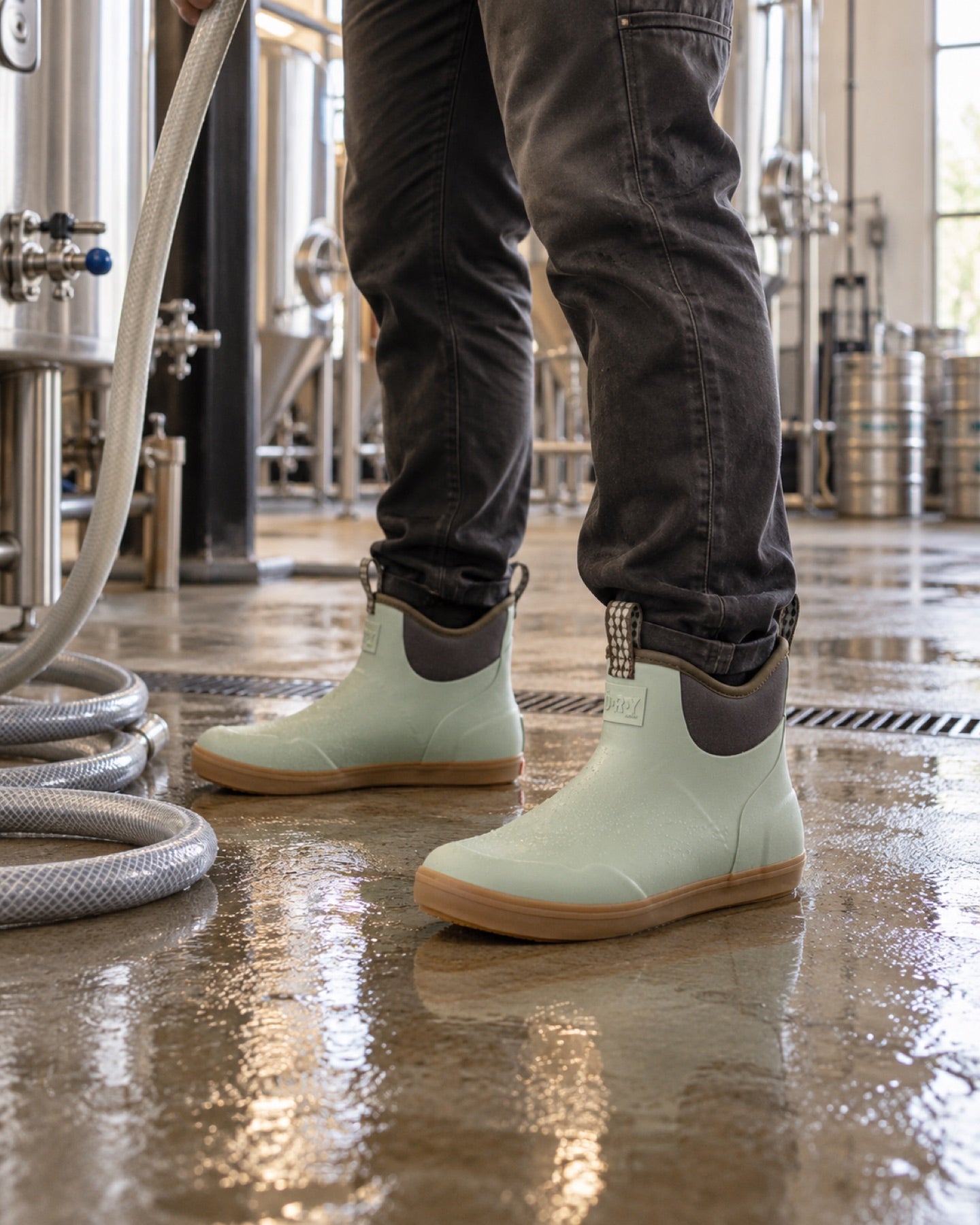 Field Sage deck boots worn while rinsing a working brewery floor