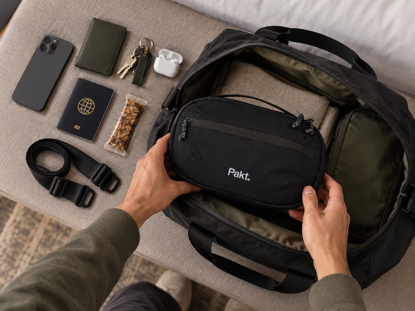 Black Pakt sling packed into a weekender as a removable organizer