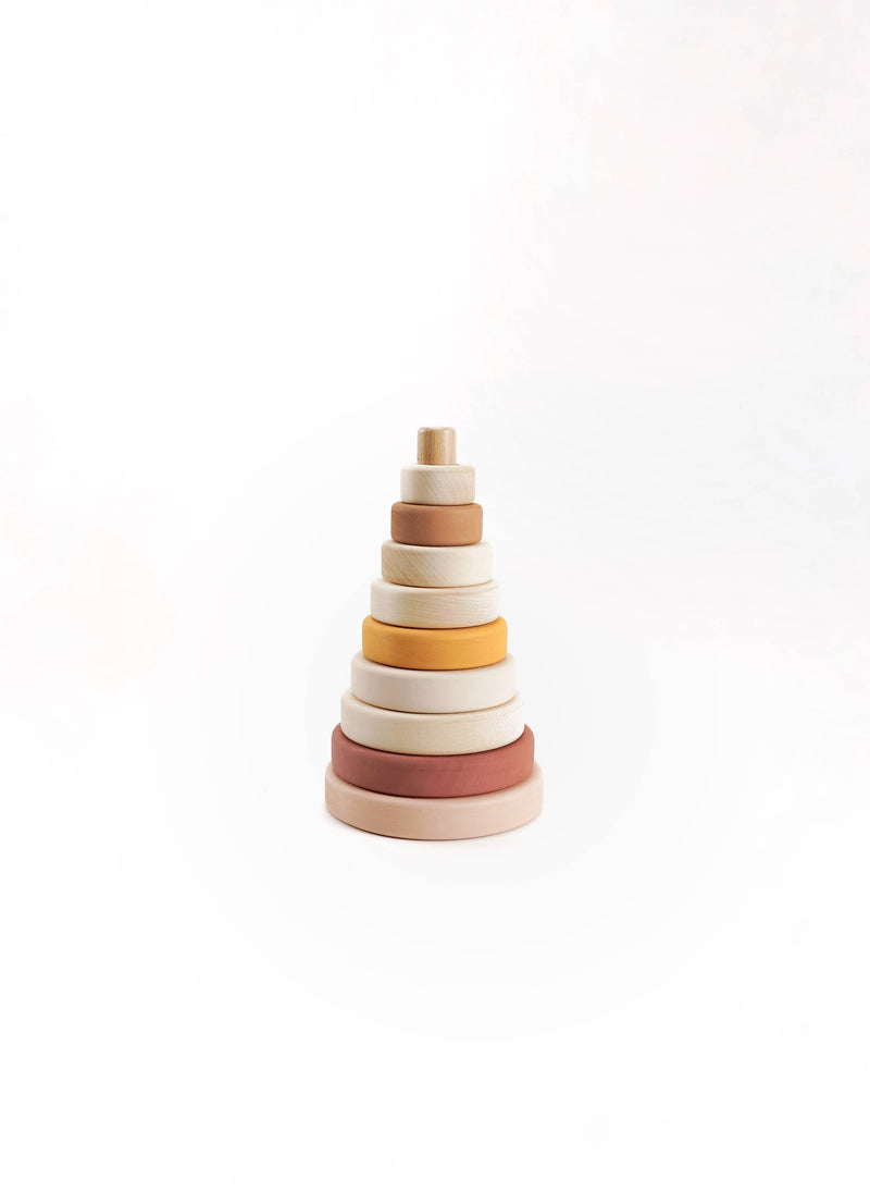 SABO wooden ring stacker in blush, mustard, and natural wood, stacked