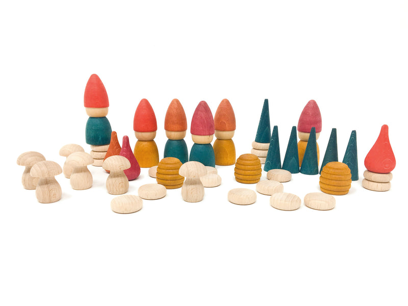 Grapat Nins Tomten figures stacked with cones, mushrooms, and coins