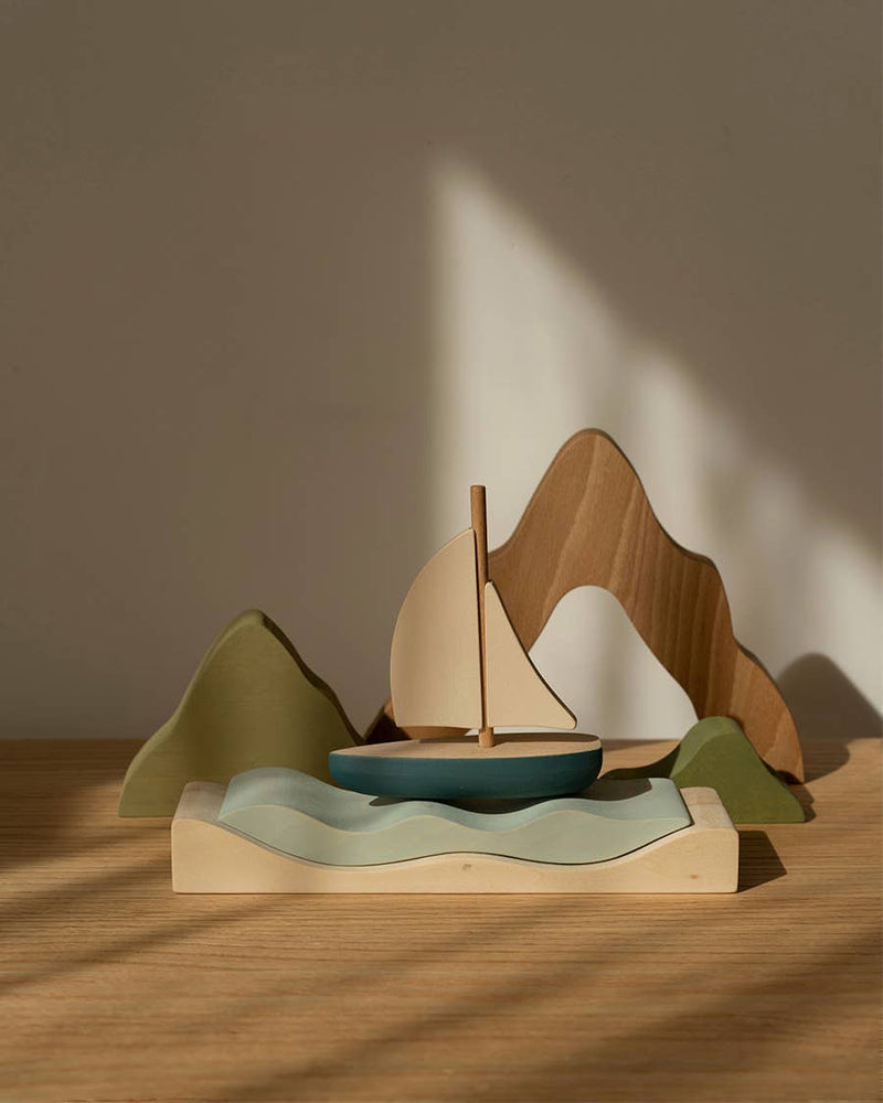 SABO Quiet Journey sailboat play set on a wooden table in sunlight