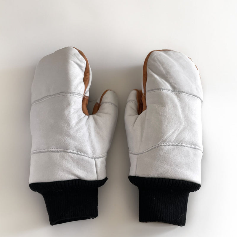 Rarely Extreme Mitten in white, lying in fresh snow