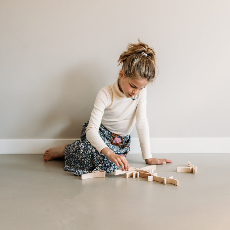 Child playing with Abel Golden Ratio 24 blocks