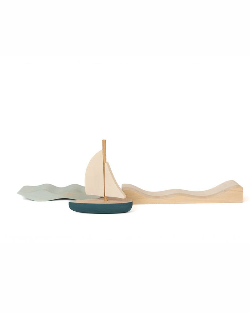 SABO Quiet Journey pieces apart: sailboat, wave insert, and wooden platform