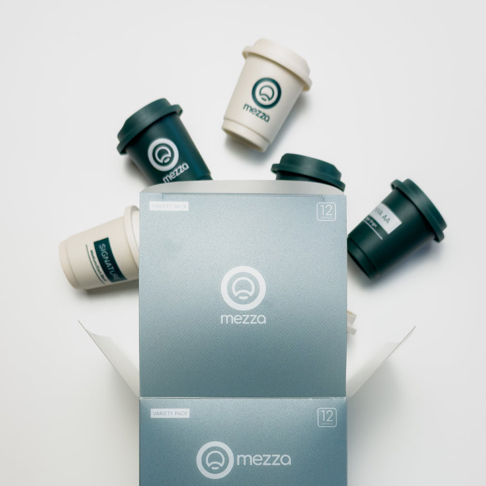 Open Mezza box showing the twelve single coffee servings