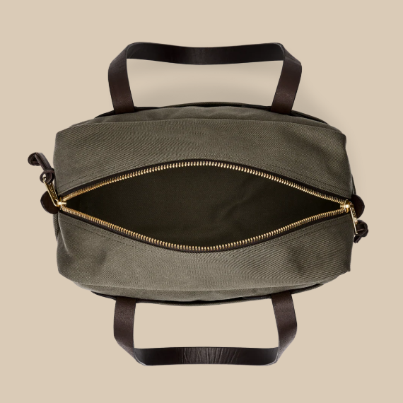Top view of the open tote, brass zipper drawn back