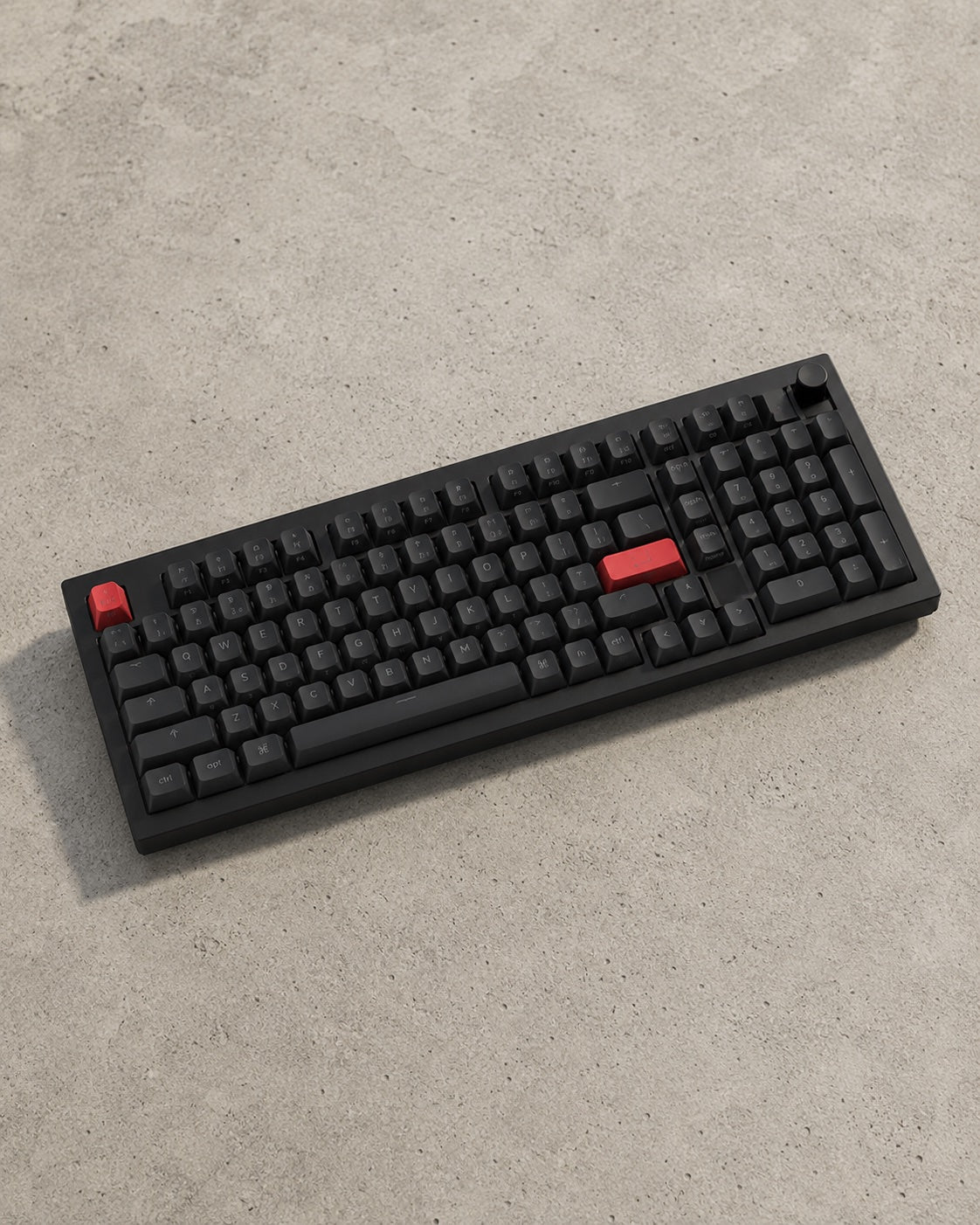 The full Q5 Max 96% layout on pale concrete, photographed at a receding three-quarter angle.