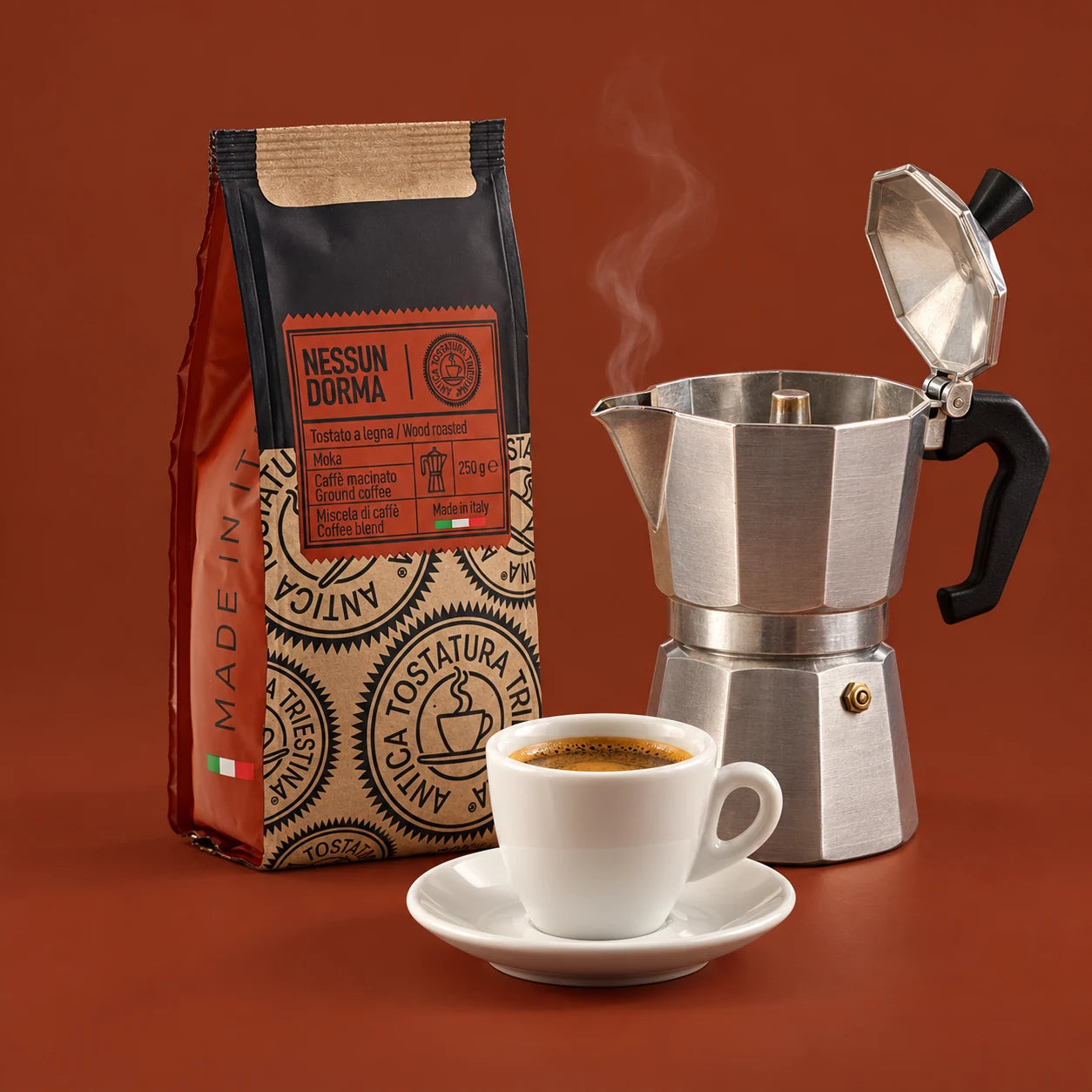 Nessun Dorma Moka Ground 250 g bag beside a stovetop moka pot and an espresso cup
