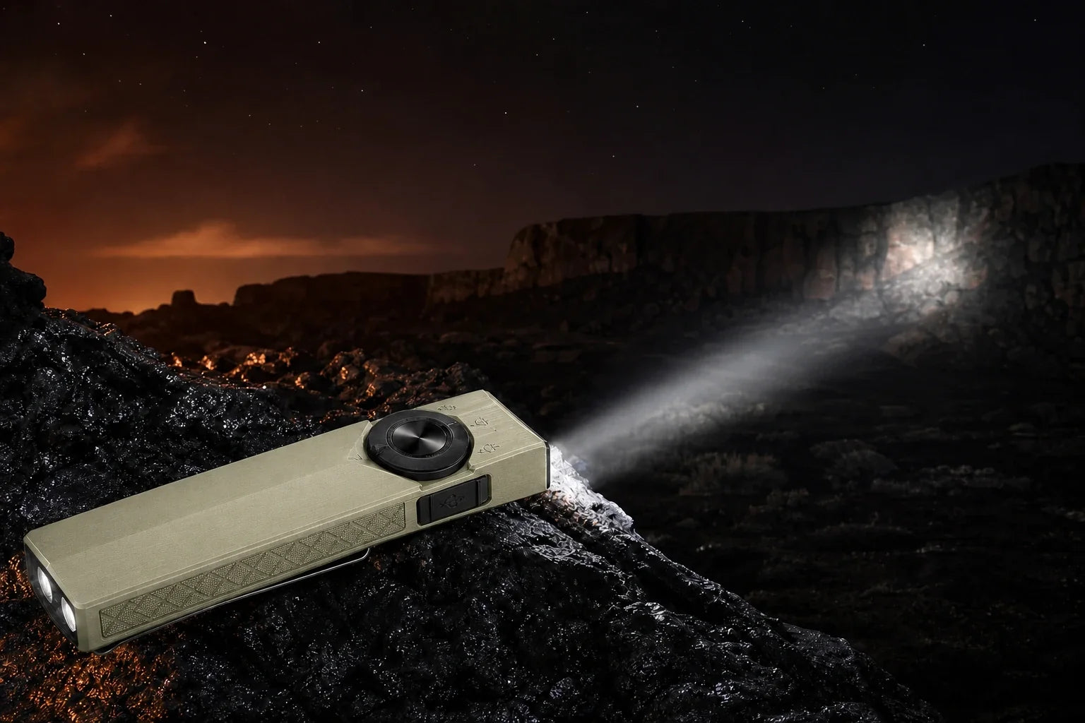 Olive Green ArkPro Ultra casting a long spotlight at night