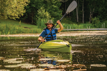 Kayaker wearing the Mesh Hiker on a lake